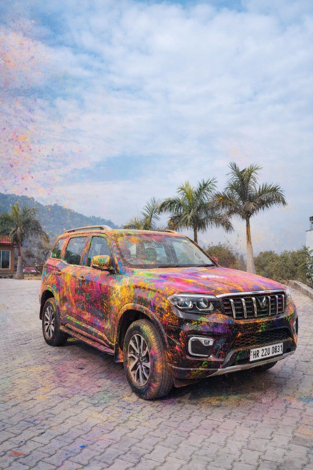 AI generated Holi color splash effect on black SUV car covered in vibrant pink yellow blue and green gulal powder outdoors